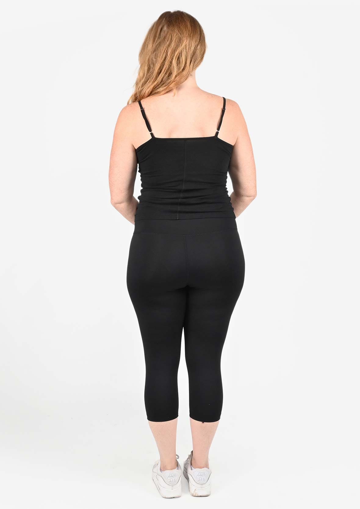 back side of high waisted black capri leggings #color_Black