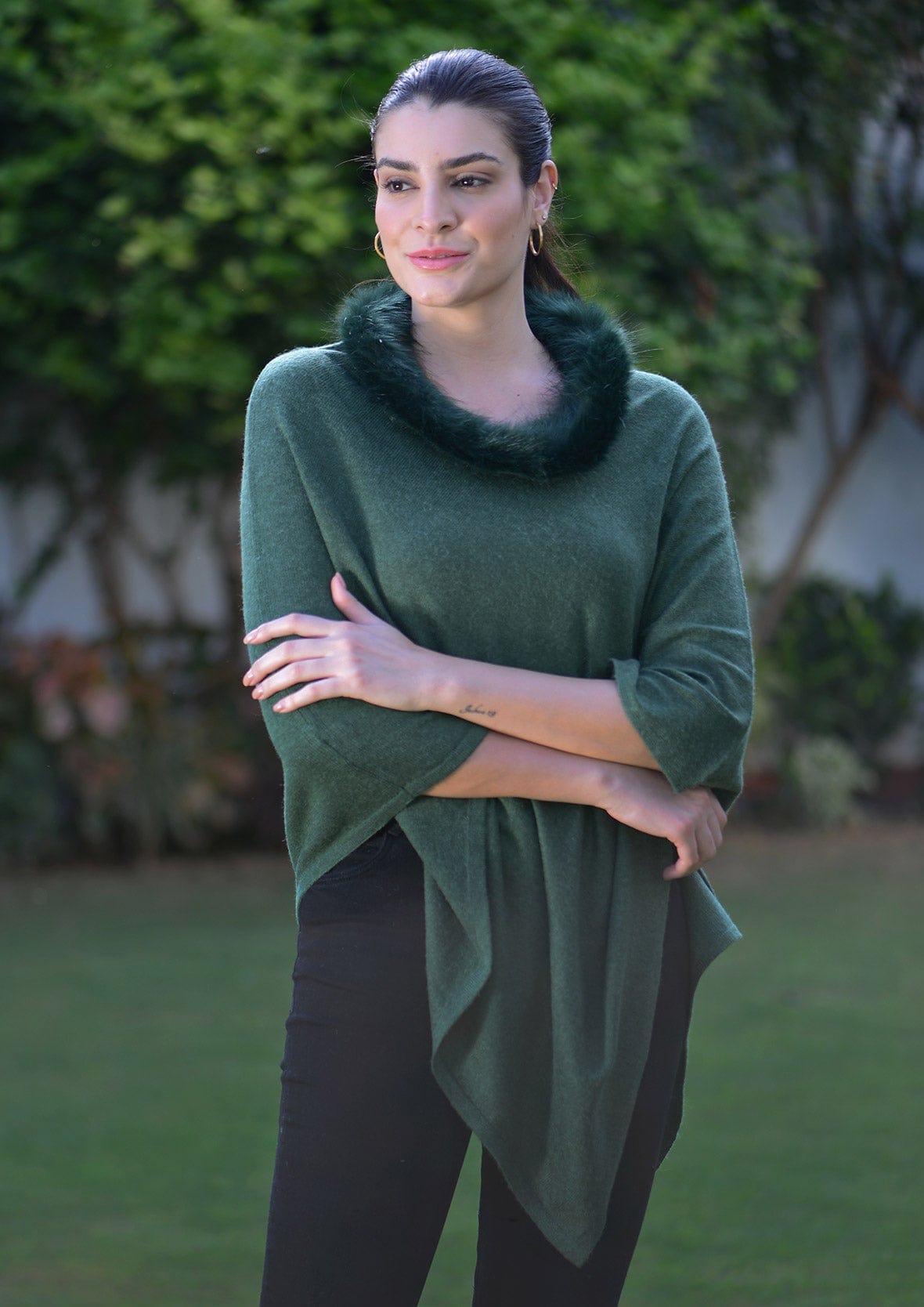 lady wearing luxurious Cashmere pashmina wool olive poncho with faux fur trim #color_Dark Olive Wool