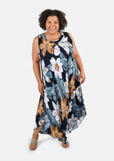 lady wearing sleeveless maxi navy based floral umbrella dress #color_Navy Based floral