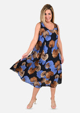lady wearing leaf print blue umbrella dress #color_Blue and Tawny Brown