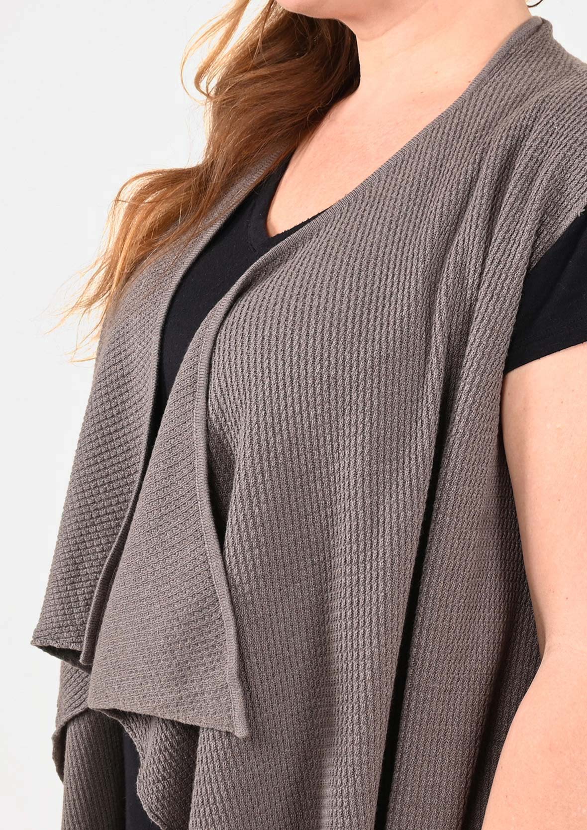 Sleeveless Knit Vest With Asymmetrical Hem