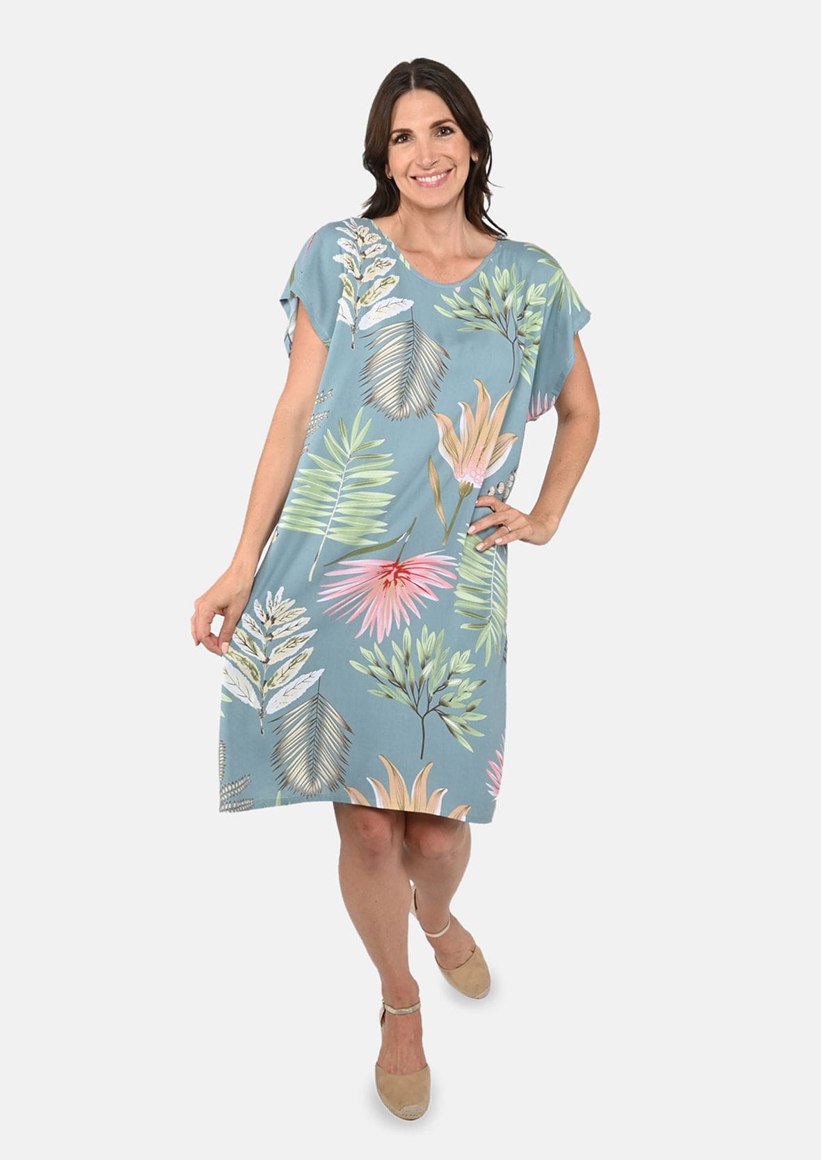 lady wearing floral print tunic green dress #color_Green and Pink Print