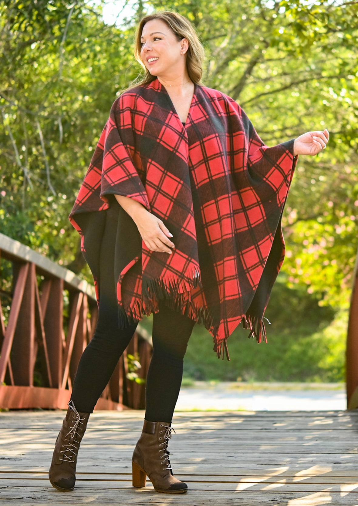 lady wearing plaid double knit red black kimono with fringe #color_Black & Red Check
