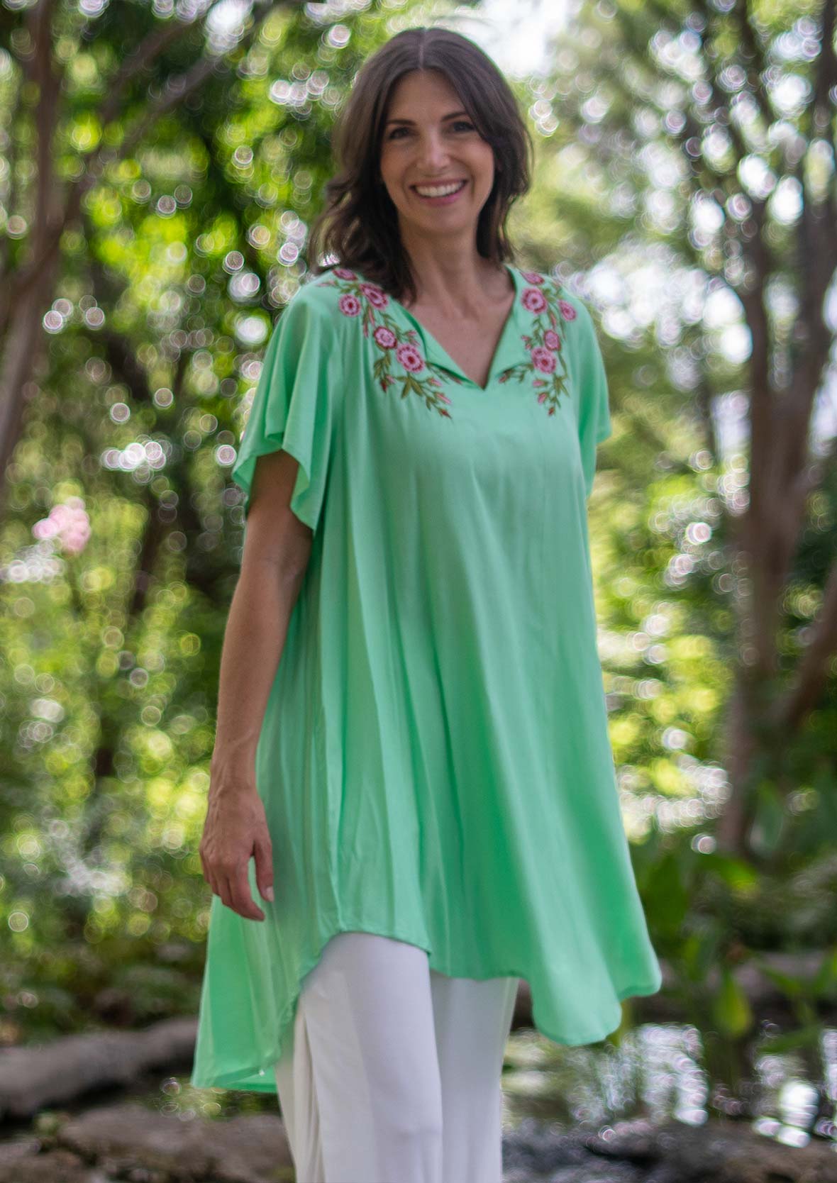 lady wearing floral embroidered green tunic #color_Seafoam Green